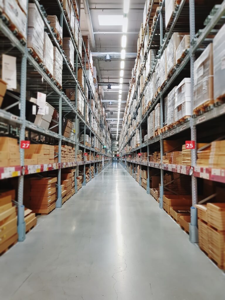 Perspective View of Aisle Between Shelves at Retailed Store Warehouse