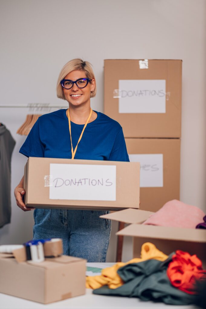 Portrait of a woman volunteer working in a charity donation center